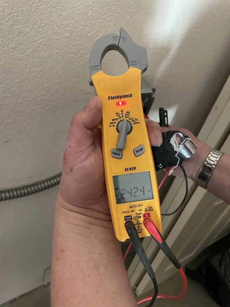 Voltage testing with clamp meter during Generator Installation in Austell